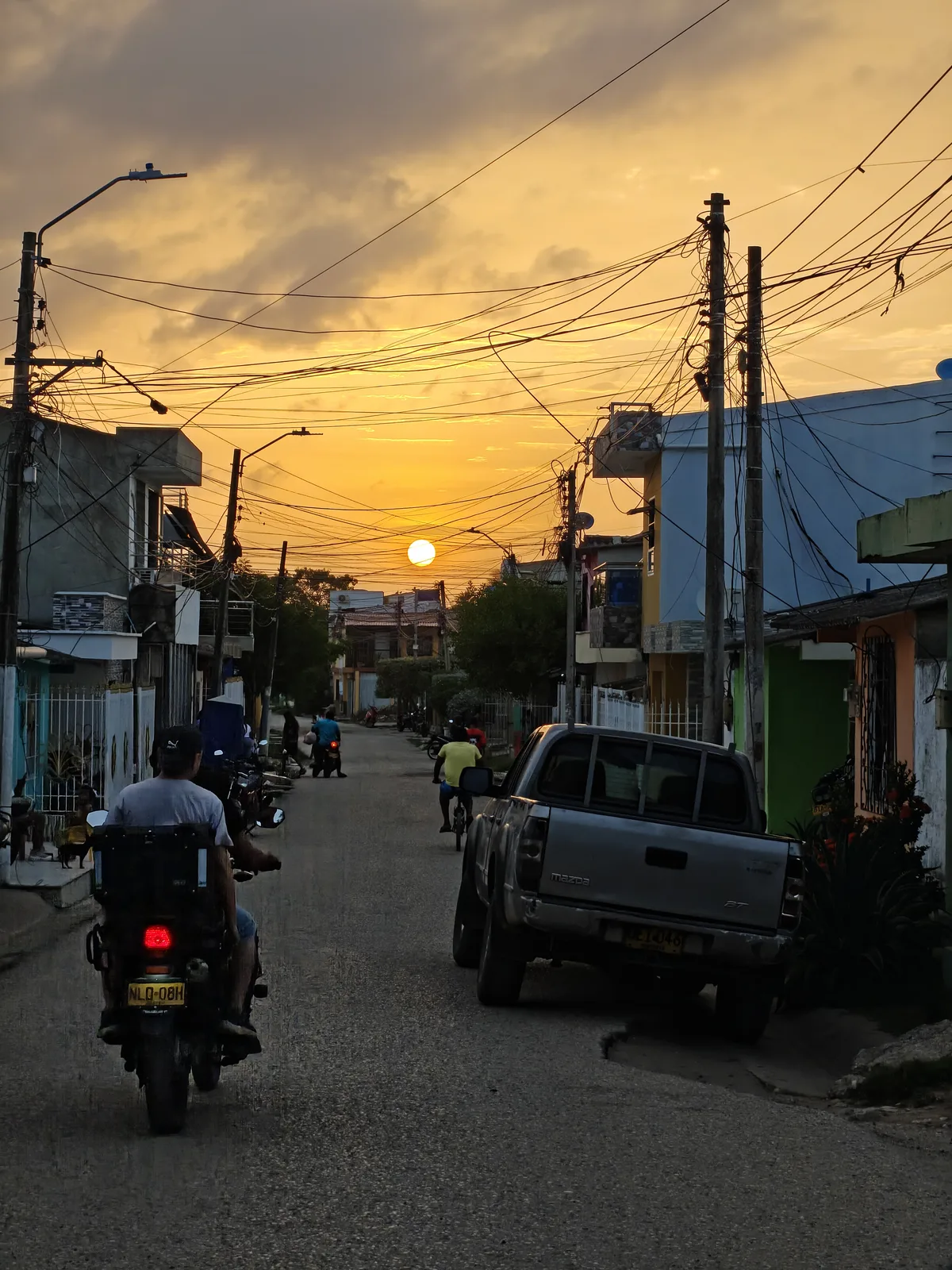 The walk out at dusk, the sun going down over the Tolú beach in the distance.