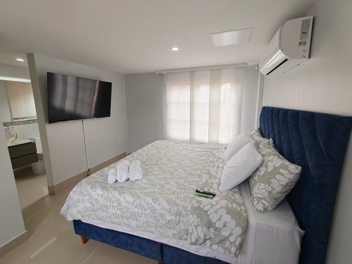 Bedroom with king bed and air conditioning