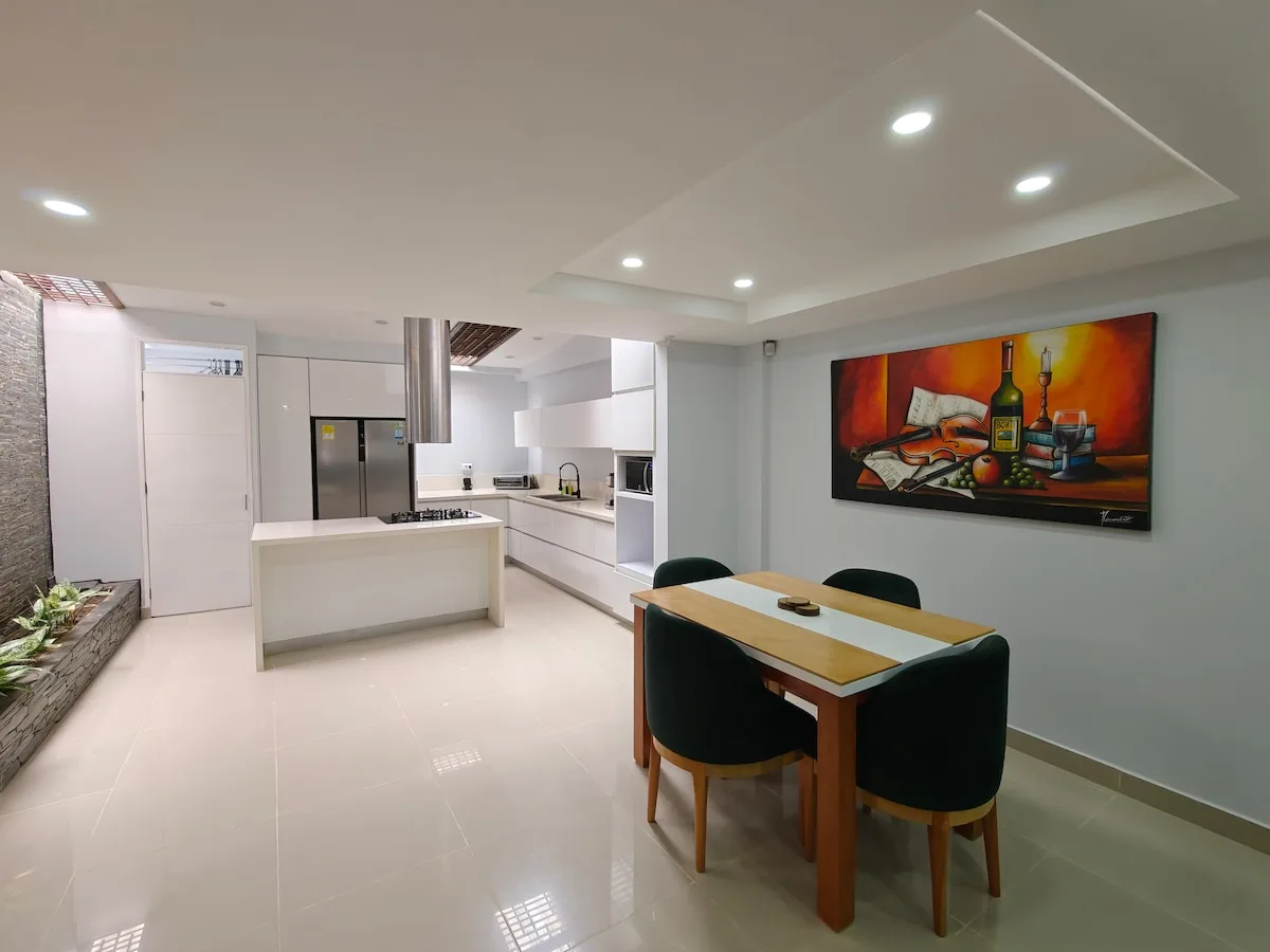 Bright open-plan kitchen and dining area of the Pinares home
